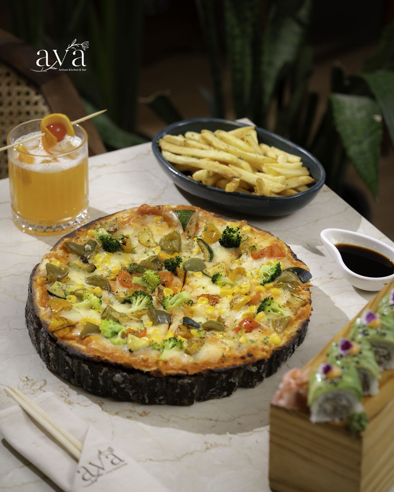 Vegetable pizza on a wooden board with fries and sushi