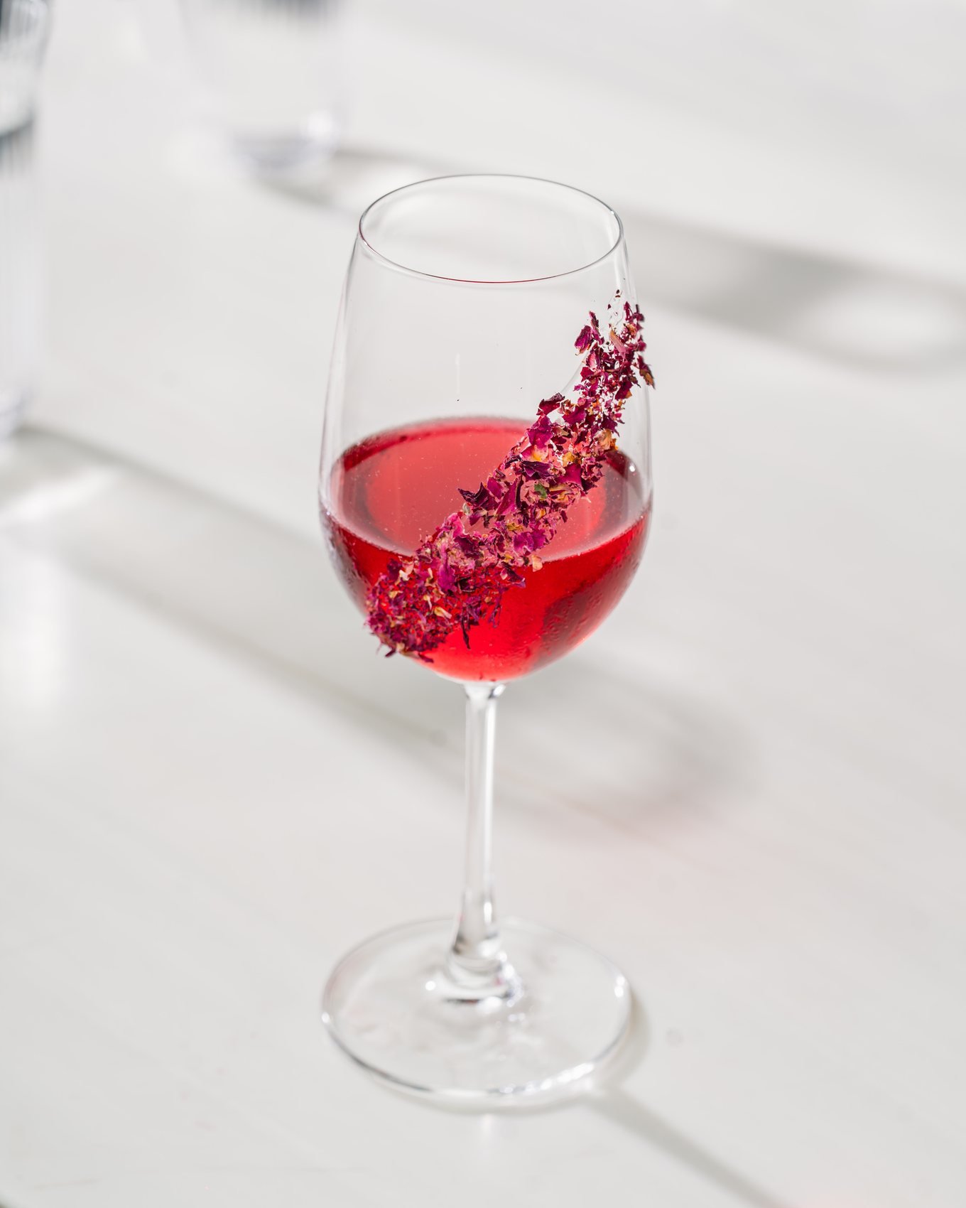 Rosé wine garnished with dried flowers