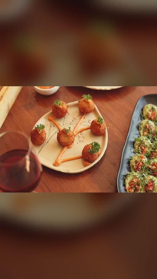 Arancini and small plates on a restaurant table